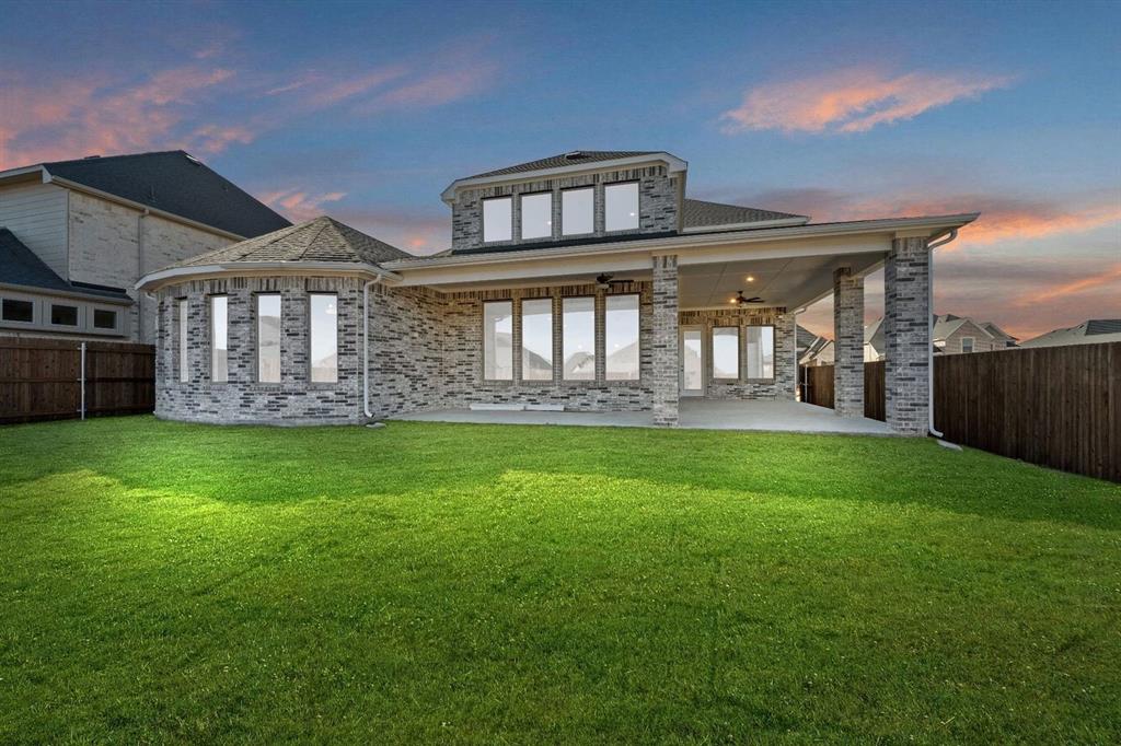 937 Mumms Drive Justin, TX 76247 - Photo 25 of 26 a front view of a house with garden