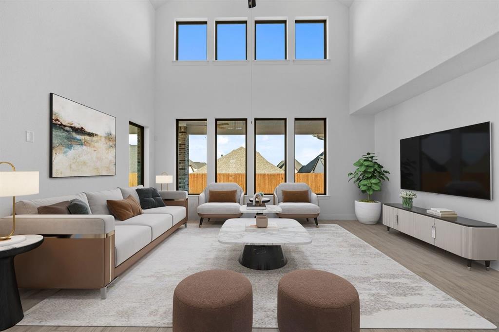 937 Mumms Drive Justin, TX 76247 - Photo 7 of 26 a living room with furniture wooden floor and a flat screen tv