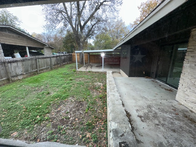 2101 Vanderbilt Lane Austin, TX 78723 - Photo 8 of 11 Fenced backyard featuring a patio