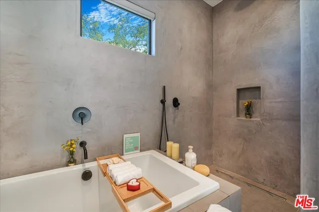 a bathroom with a tub and sink