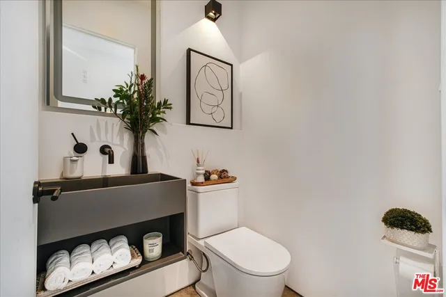 a bathroom with a toilet and a sink