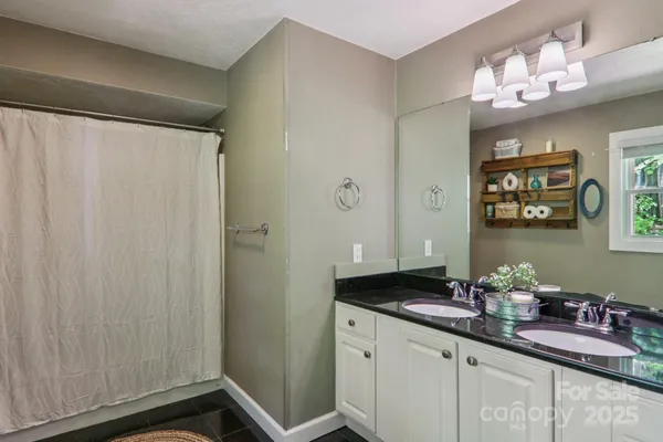 a bathroom with a sink a vanity and a mirror