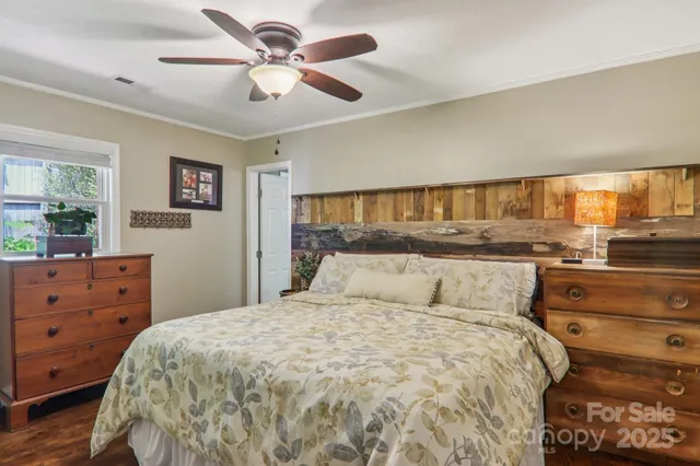 a bed room with a bed and a dresser