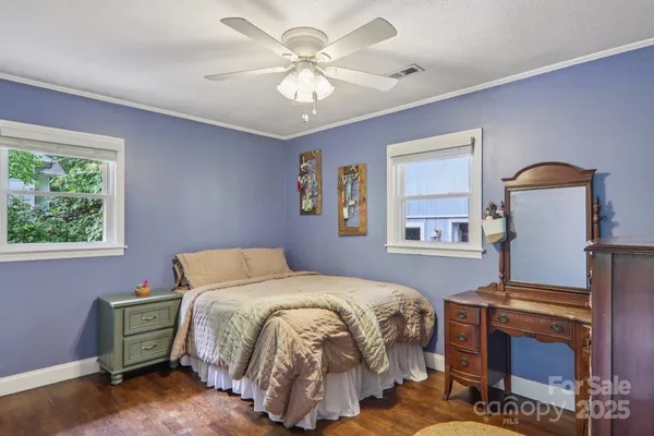 a bedroom with a bed and a fireplace