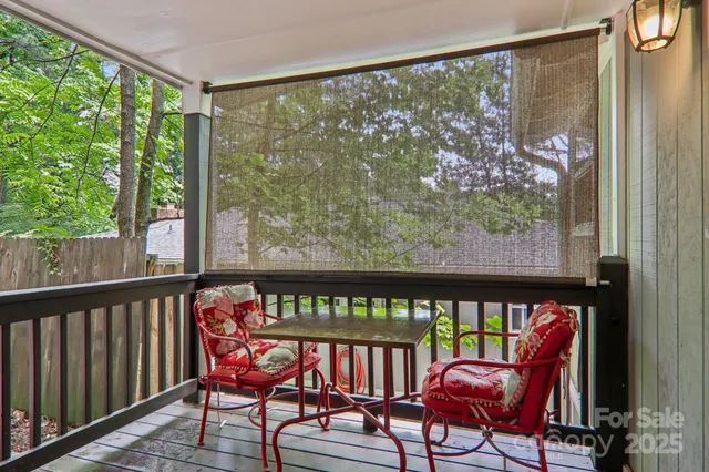 a outdoor view from a balcony with furniture