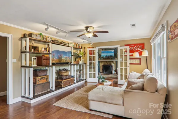 a living room with furniture and a flat screen tv