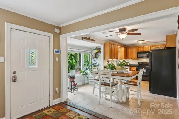 a dining room with furniture and a window