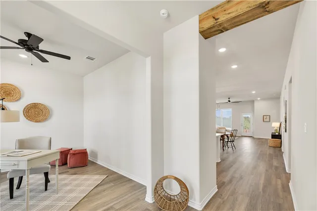 a hallway with wooden floor