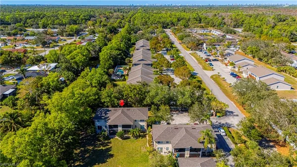 an aerial view of residential houses with outdoor space