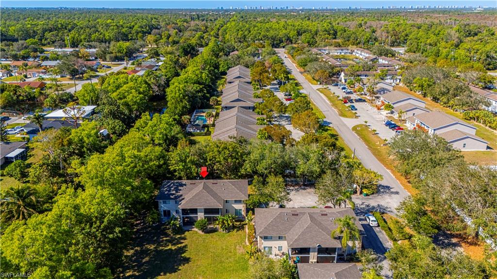 5434 16th Place Southwest, Unit D3 Golden Gate, FL 34116 - Photo 5 of 17 an aerial view of residential houses with outdoor space
