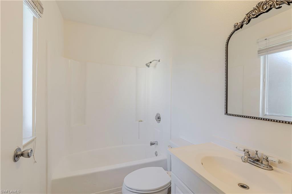 5434 16th Place Southwest, Unit D3 Golden Gate, FL 34116 - Photo 10 of 17 a bathroom with a sink and a bathtub