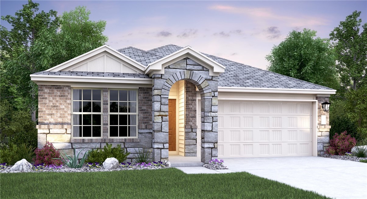 a front view of a house with a garden and plants