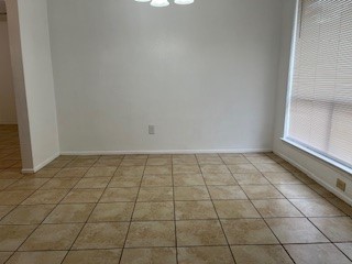 4419 Stallion Brook Lane Spring, TX 77388 - Photo 7 of 15 a view of a room with white tiles and a window