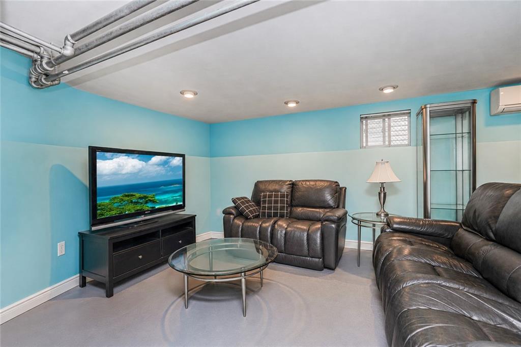 1352 Bay Ridge Parkway Brooklyn, NY 11228 - Photo 32 of 42 a living room with furniture and a flat screen tv