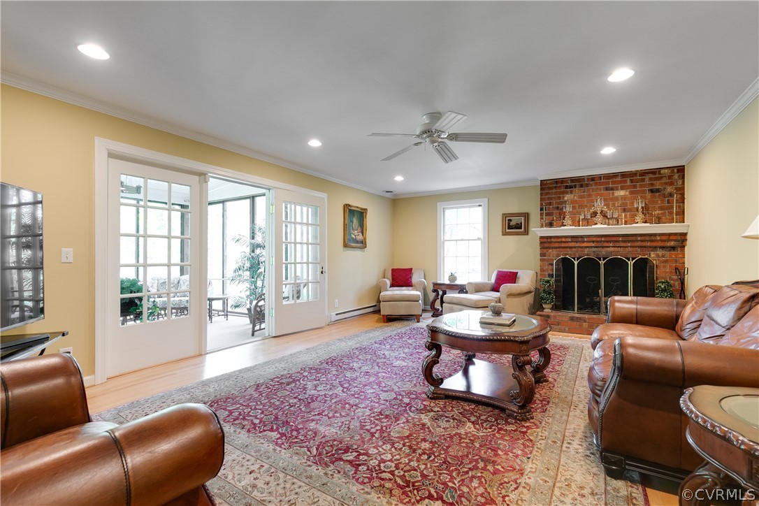 2780 East Brigstock Road Midlothian, VA 23113 - Photo 12 of 50 a living room with furniture fireplace and a large window