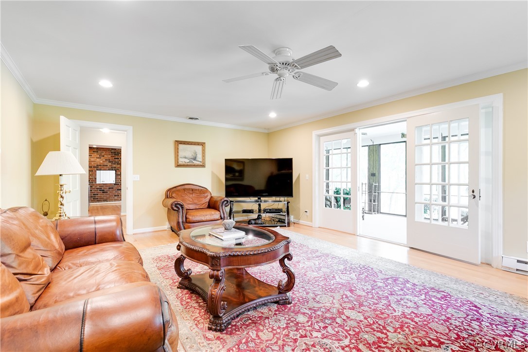 2780 East Brigstock Road Midlothian, VA 23113 - Photo 13 of 50 a living room with furniture and a flat screen tv