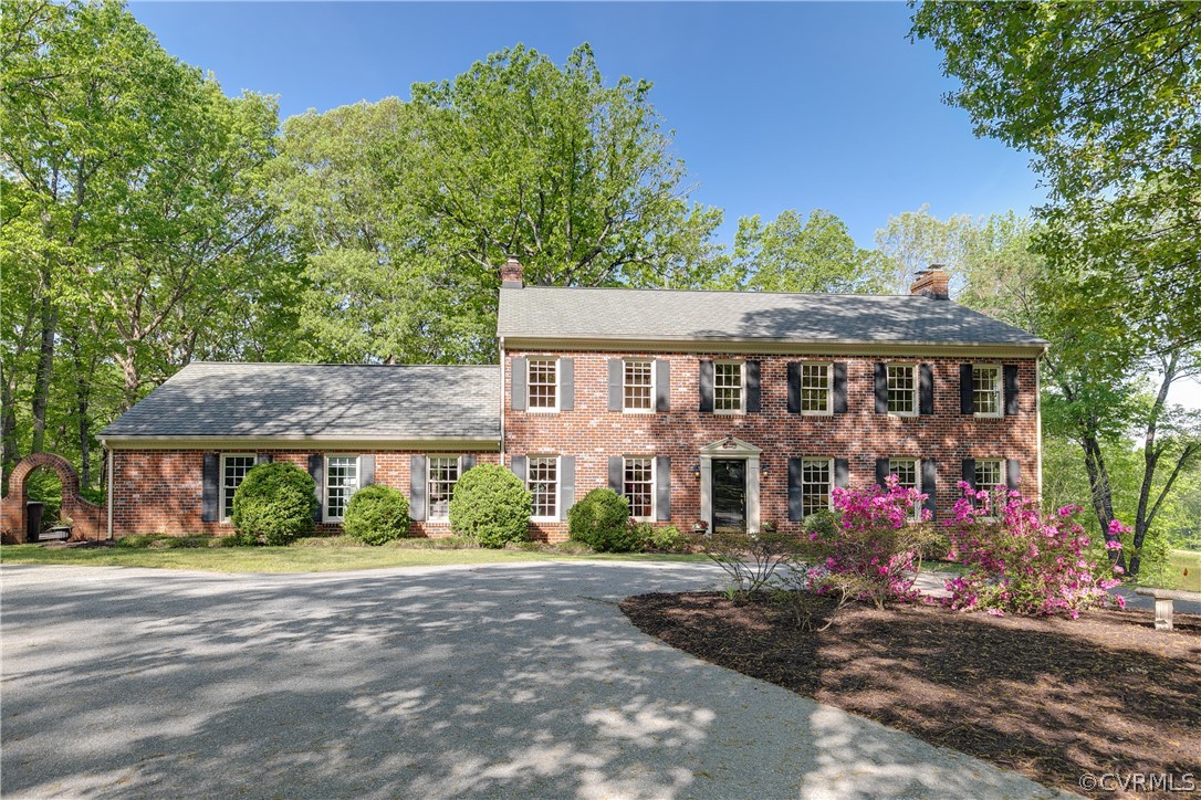 2780 East Brigstock Road Midlothian, VA 23113 - Photo 2 of 50 a front view of a house with a yard