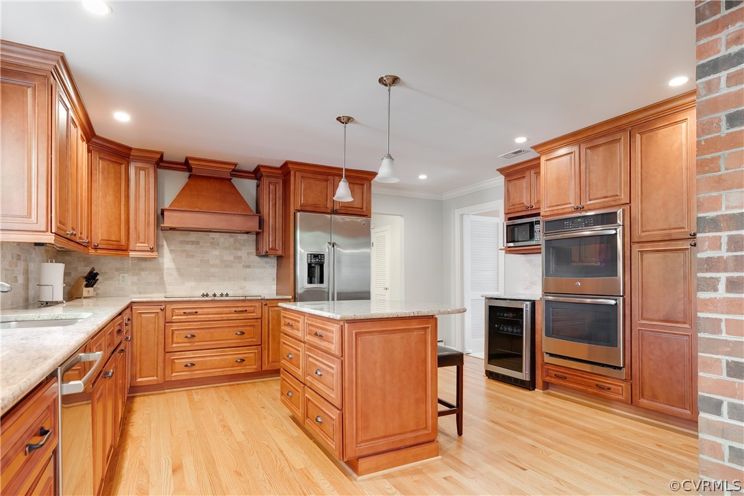 2780 East Brigstock Road Midlothian, VA 23113 - Photo 21 of 50 a kitchen with stainless steel appliances a stove sink and cabinets
