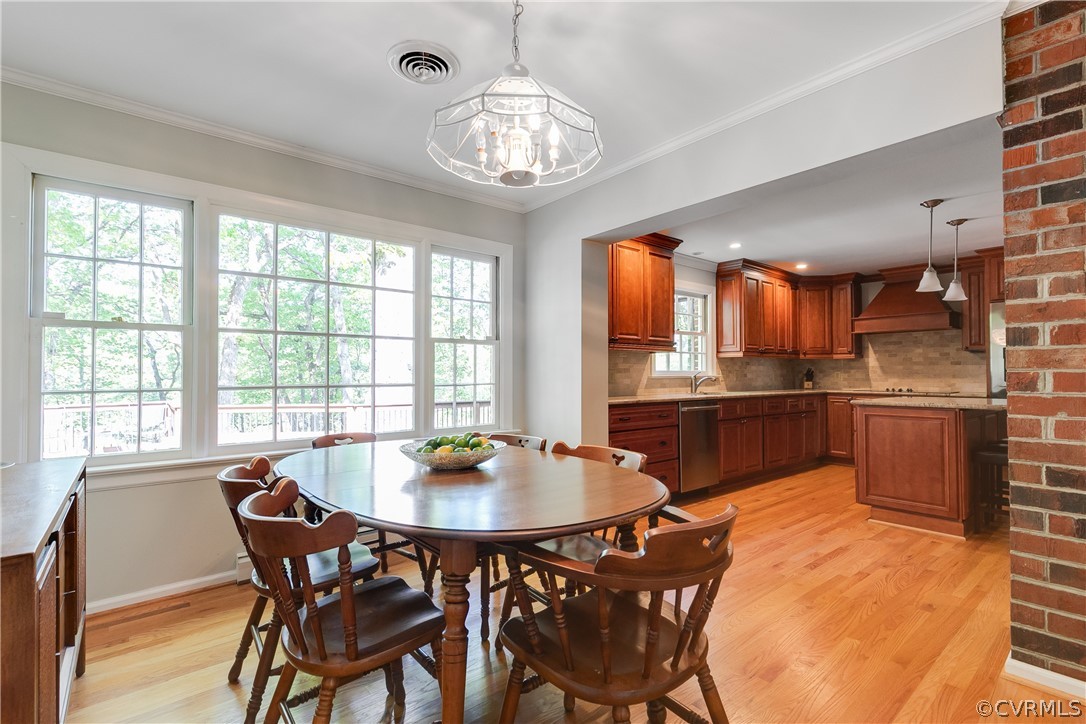 2780 East Brigstock Road Midlothian, VA 23113 - Photo 23 of 50 a kitchen with a table and chairs in it