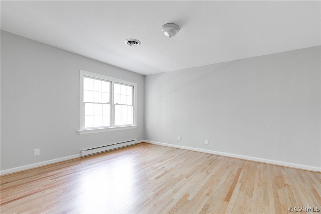 2780 East Brigstock Road Midlothian, VA 23113 - Photo 29 of 50 an empty room with wooden floor and windows