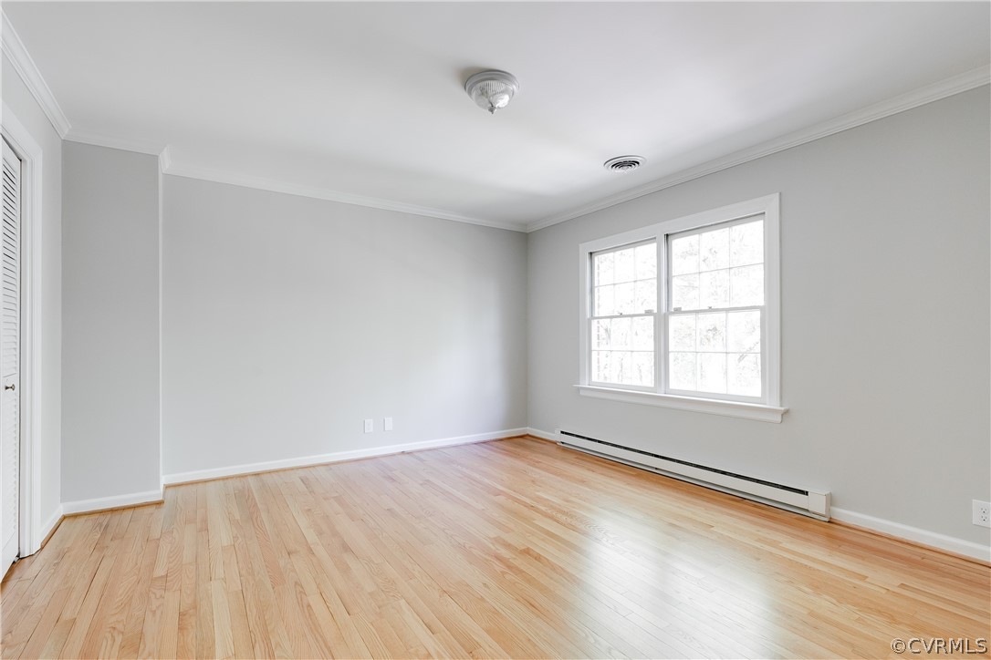 2780 East Brigstock Road Midlothian, VA 23113 - Photo 32 of 50 an empty room with wooden floor and windows