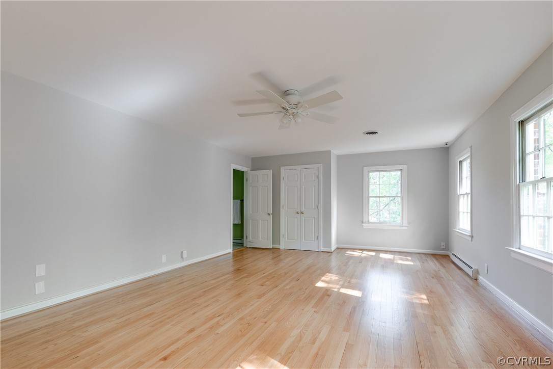 2780 East Brigstock Road Midlothian, VA 23113 - Photo 34 of 50 an empty room with wooden floor and windows