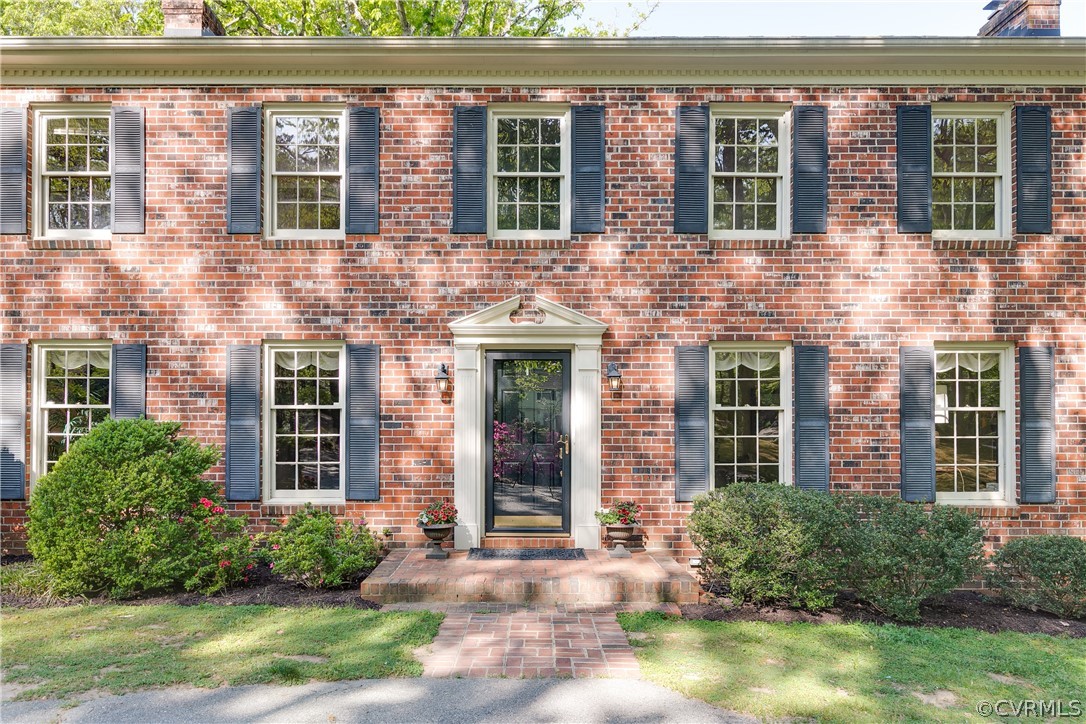2780 East Brigstock Road Midlothian, VA 23113 - Photo 4 of 50 front view of a brick house with a large windows