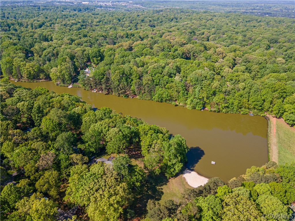 2780 East Brigstock Road Midlothian, VA 23113 - Photo 47 of 50 a view of a lake with a yard