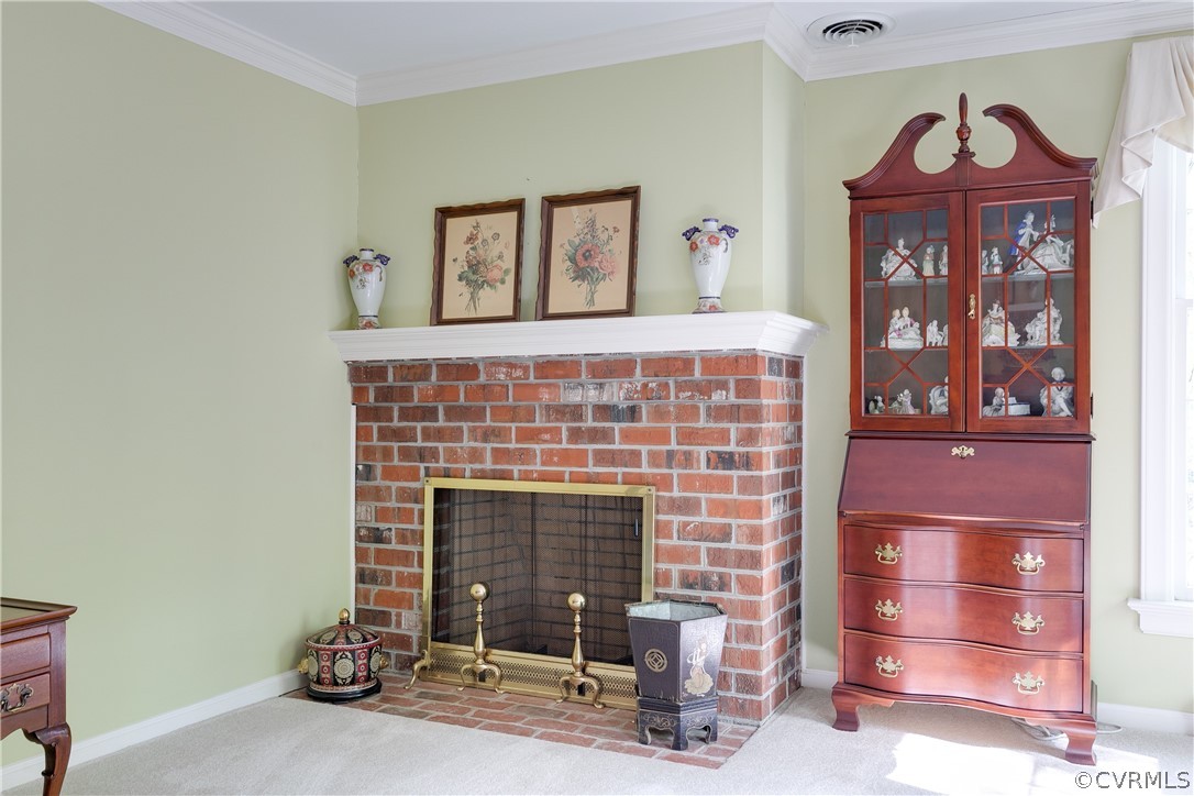 2780 East Brigstock Road Midlothian, VA 23113 - Photo 7 of 50 a living room with furniture and a fireplace