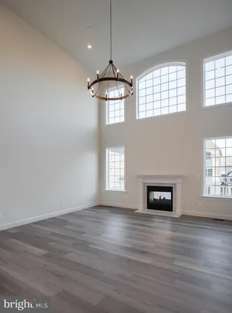 an empty room with wooden floor