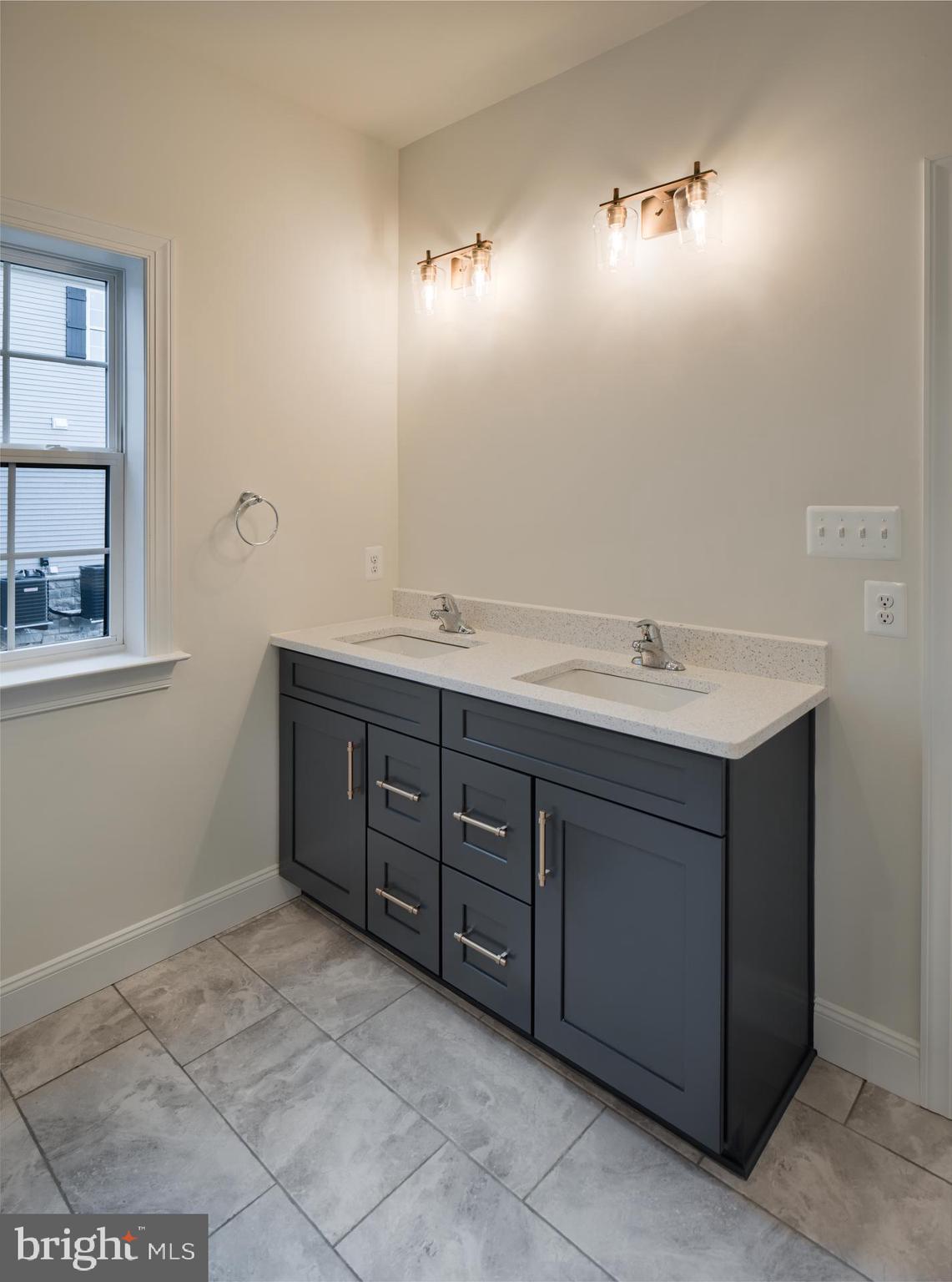 8528 Rocky Springs Road Frederick, MD 21702 - Photo 29 of 93 a bathroom with a sink vanity and mirror