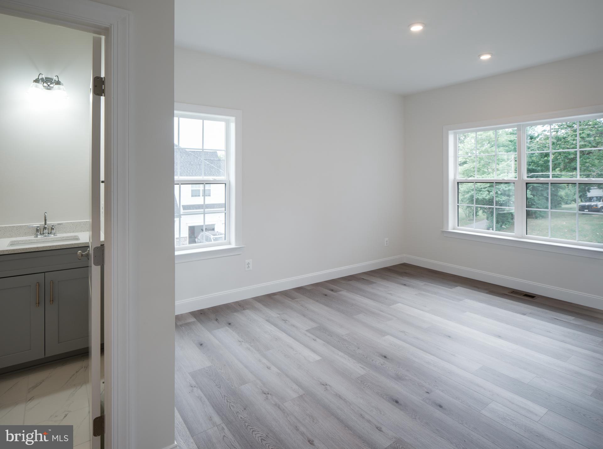 8528 Rocky Springs Road Frederick, MD 21702 - Photo 31 of 93 an empty room with wooden floor and windows