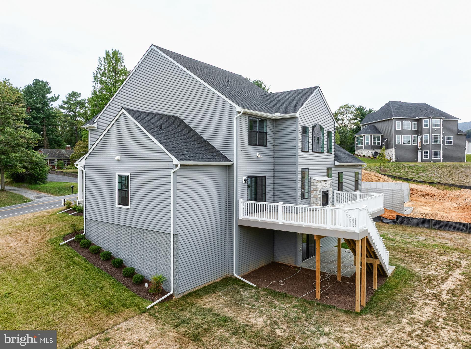8528 Rocky Springs Road Frederick, MD 21702 - Photo 56 of 93 a view of house with backyard porch and outdoor seating