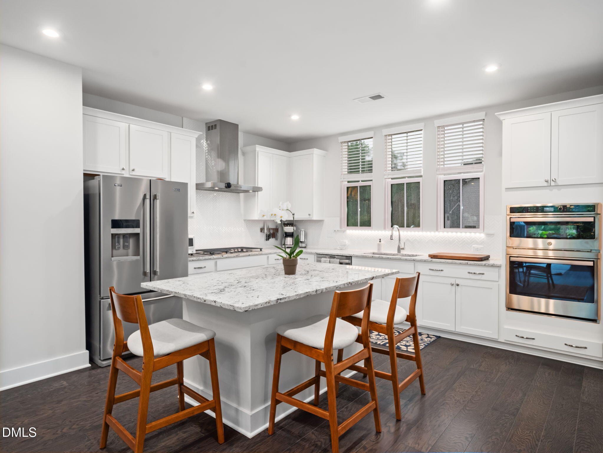 916 Waterside View Drive Raleigh, NC 27606 - Photo 1 of 22 a kitchen with refrigerator and chairs