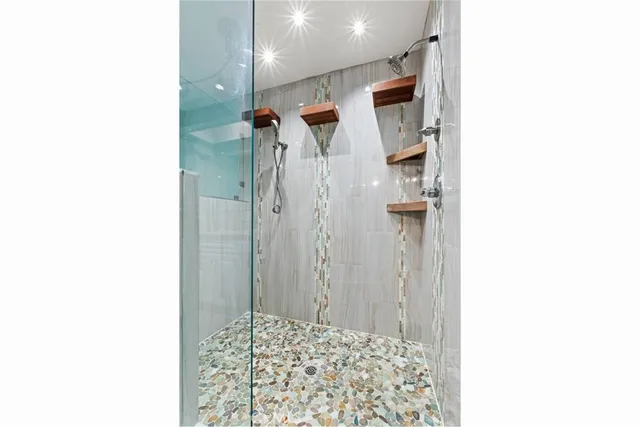 a picture of a bathroom with a shower
