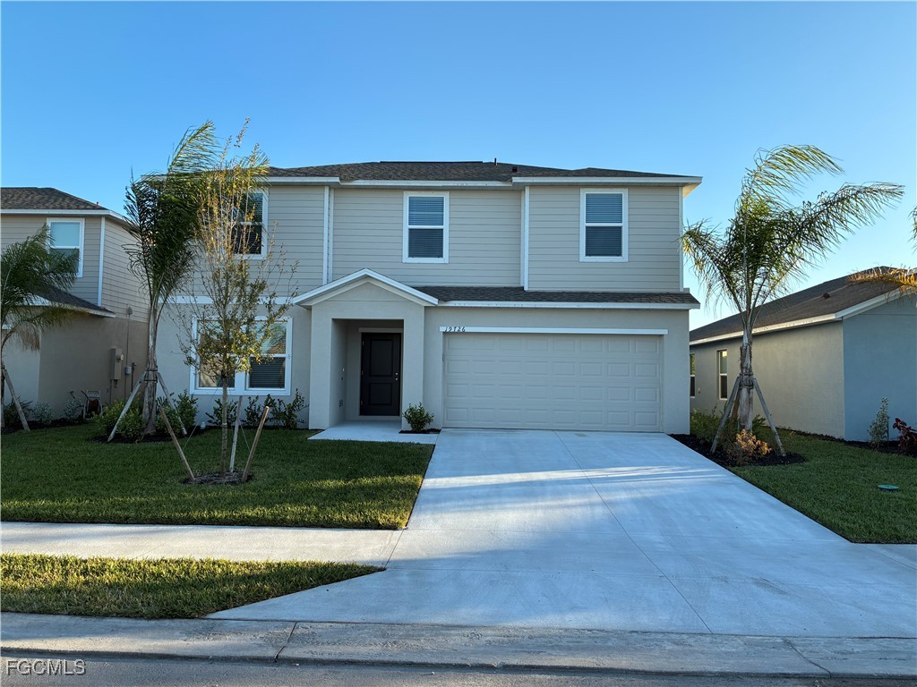 19726 Lavender Field Lehigh Acres, FL 33936 - Photo 1 of 7 a front view of a house with a yard and garage