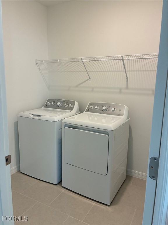 19726 Lavender Field Lehigh Acres, FL 33936 - Photo 5 of 7 a utility room with dryer and washer