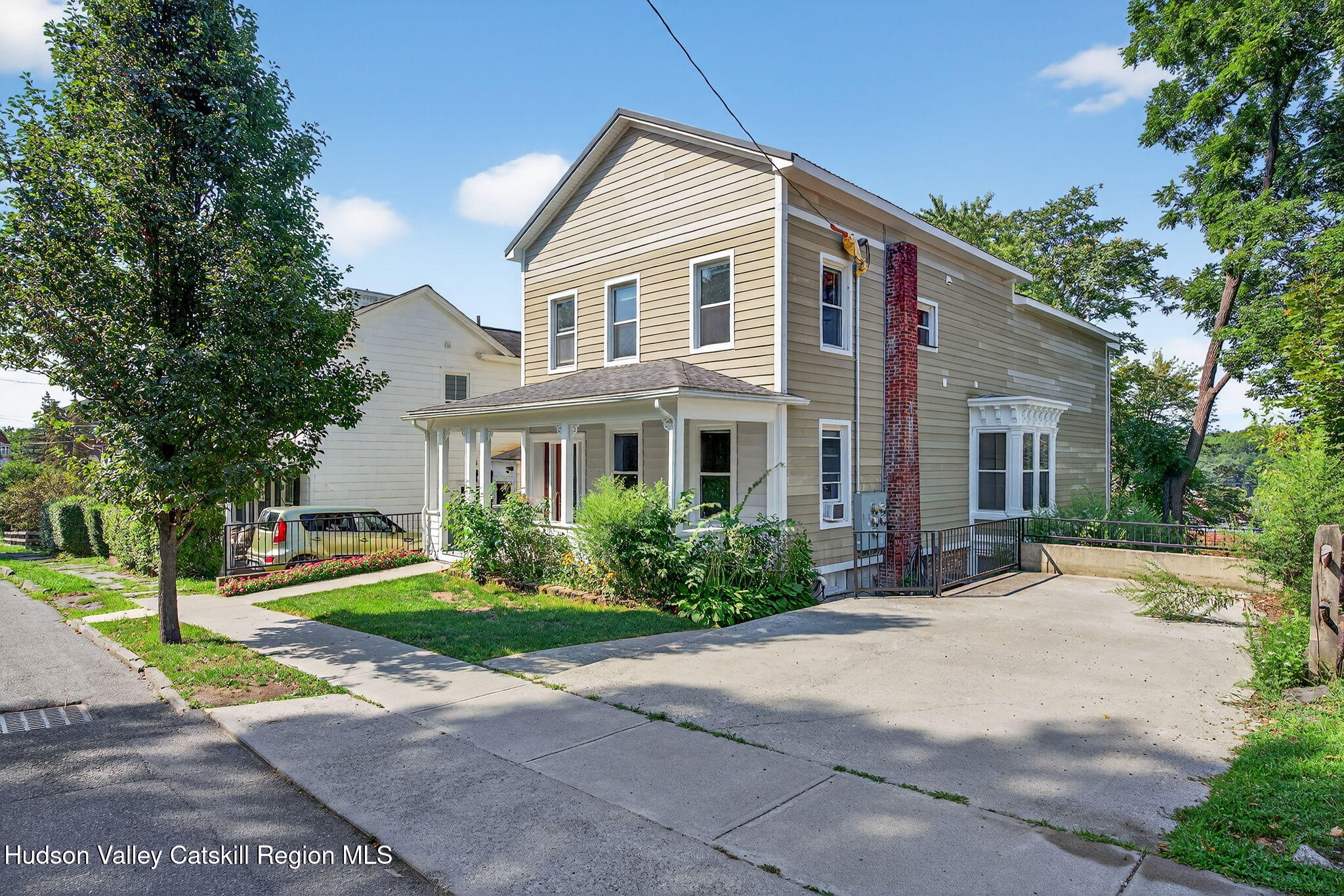 17 New Street Catskill, NY 12414 - Photo 1 of 92 a front view of a house with a yard and trees
