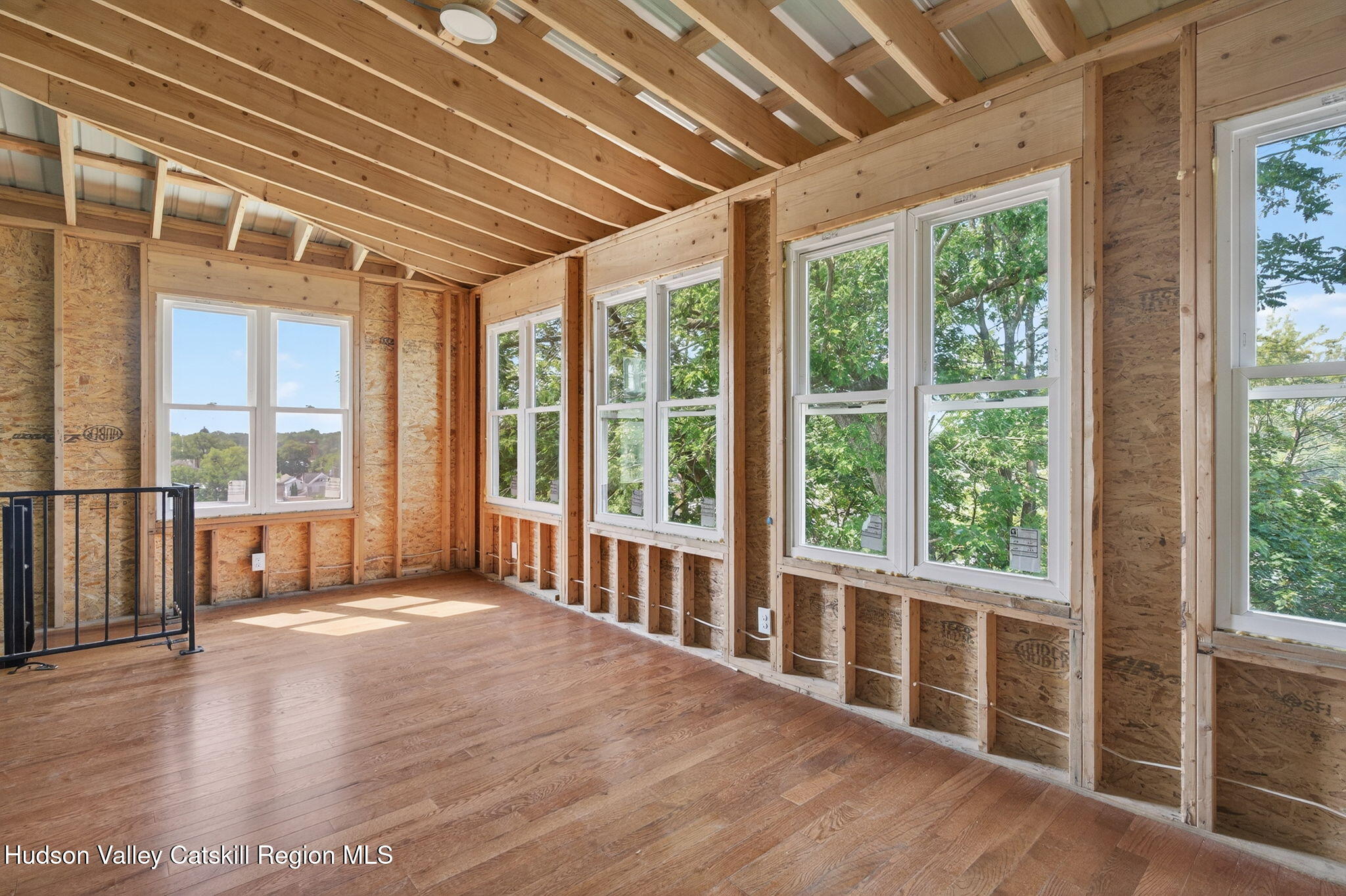 17 New Street Catskill, NY 12414 - Photo 53 of 92 a view of an empty room with wooden floor and a window