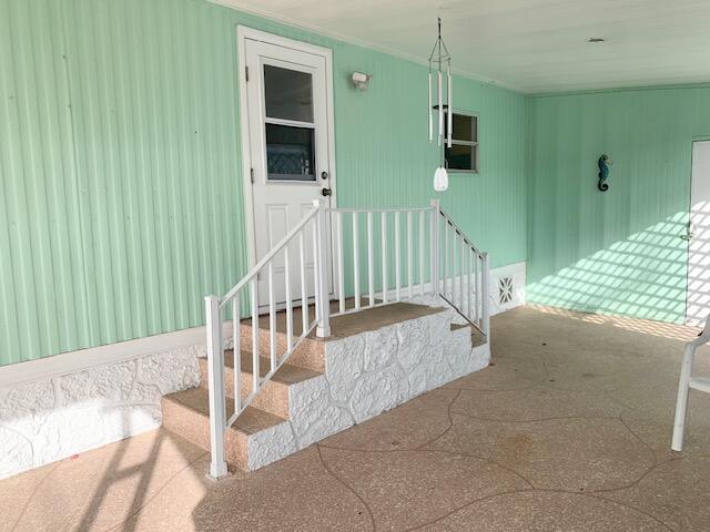 808 South Silver Circle Key Largo, FL 33037 - Photo 7 of 50 a view of balcony with wooden floor and outdoor seating