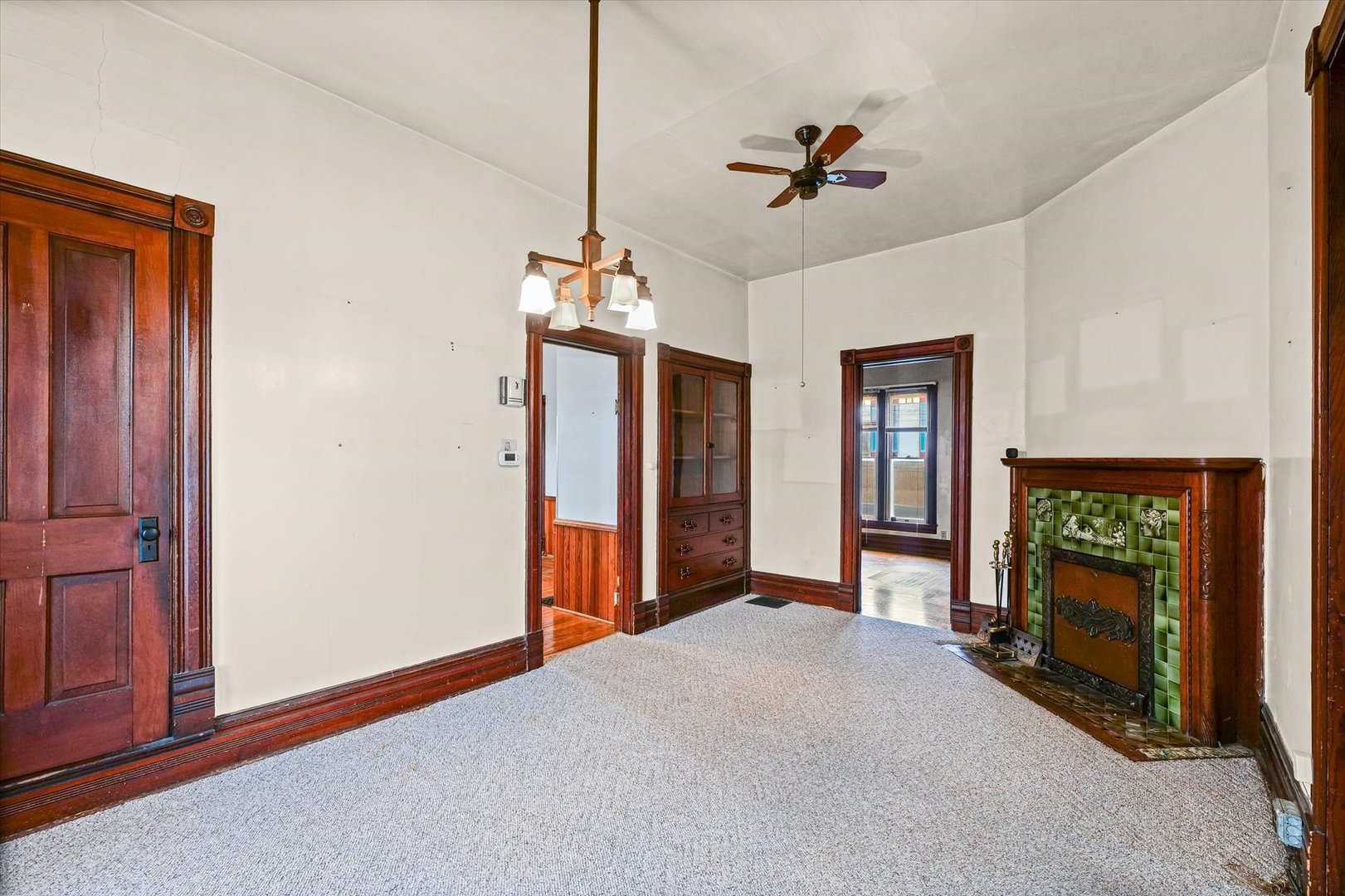 310 North Main Street Homer, IL 61849 - Photo 11 of 25 a view of a livingroom with a fireplace a chandelier and closet