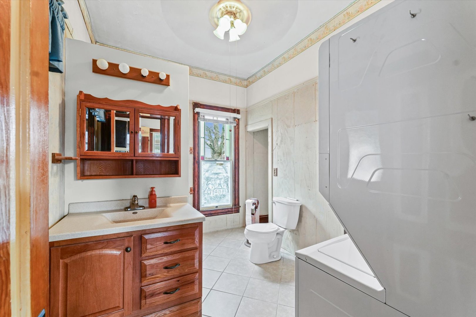 310 North Main Street Homer, IL 61849 - Photo 15 of 25 a bathroom with a sink a toilet and a shower curtain