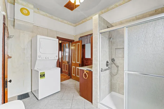 a bathroom with a shower and a sink