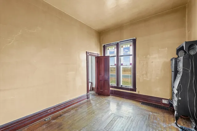 a view of livingroom with hardwood floor and a window