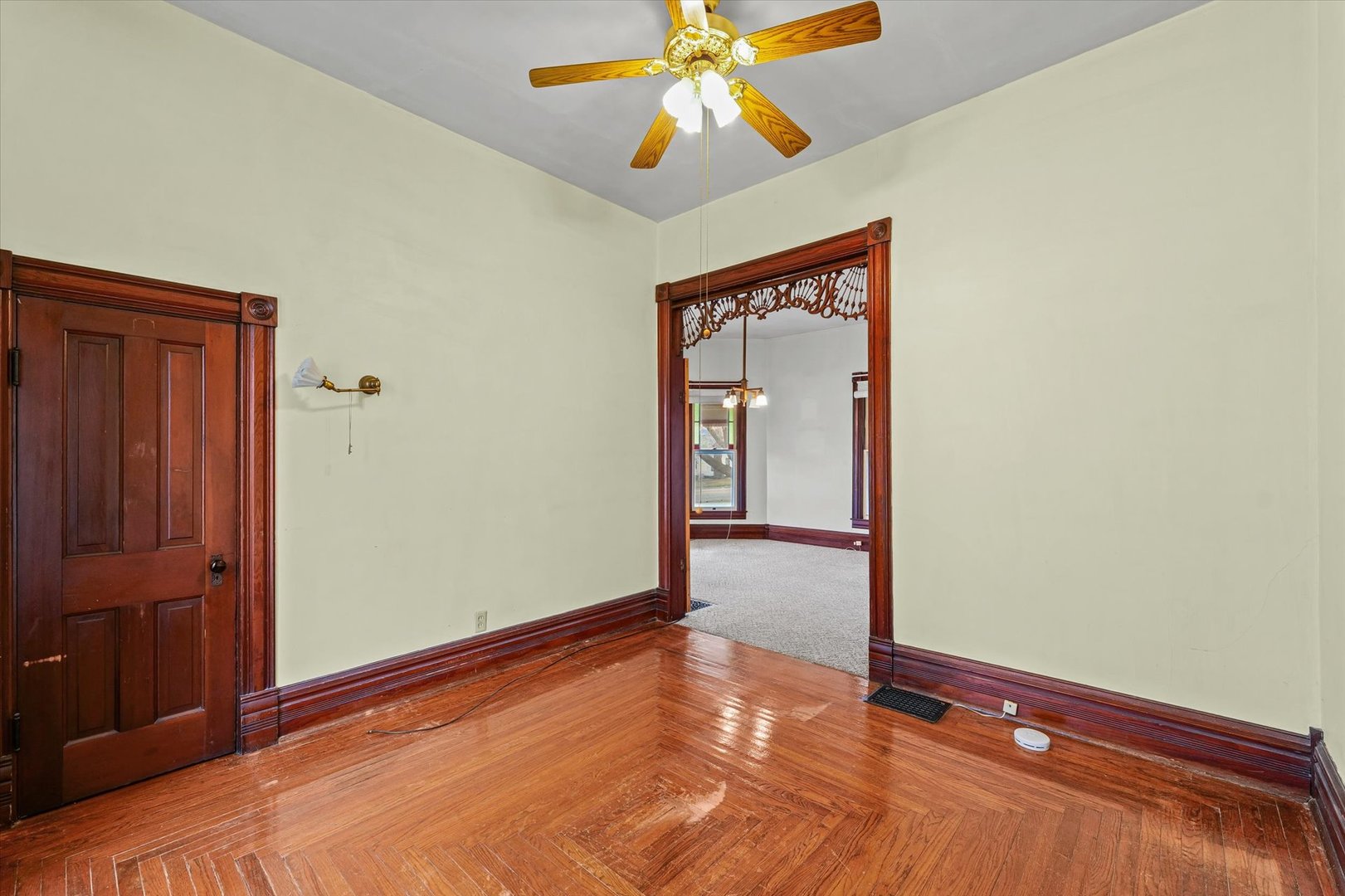 310 North Main Street Homer, IL 61849 - Photo 21 of 25 a view of an empty room with window and wooden floor