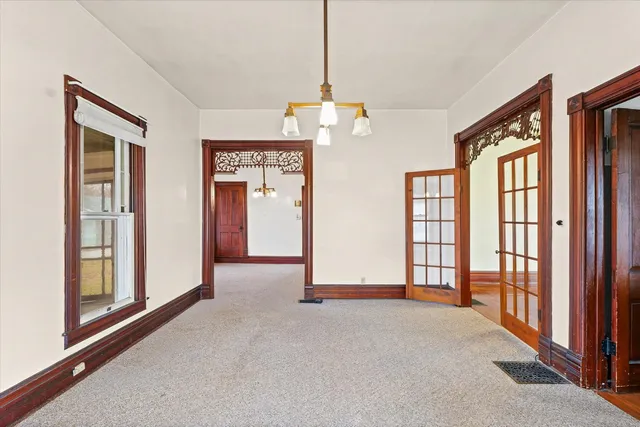 a view of empty room with windows