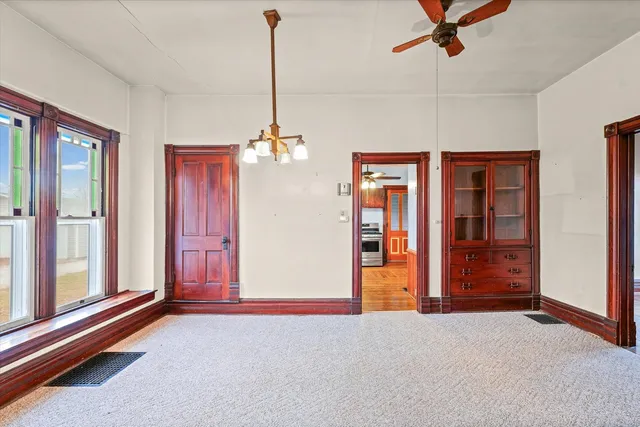 a view of empty room with ceiling fan