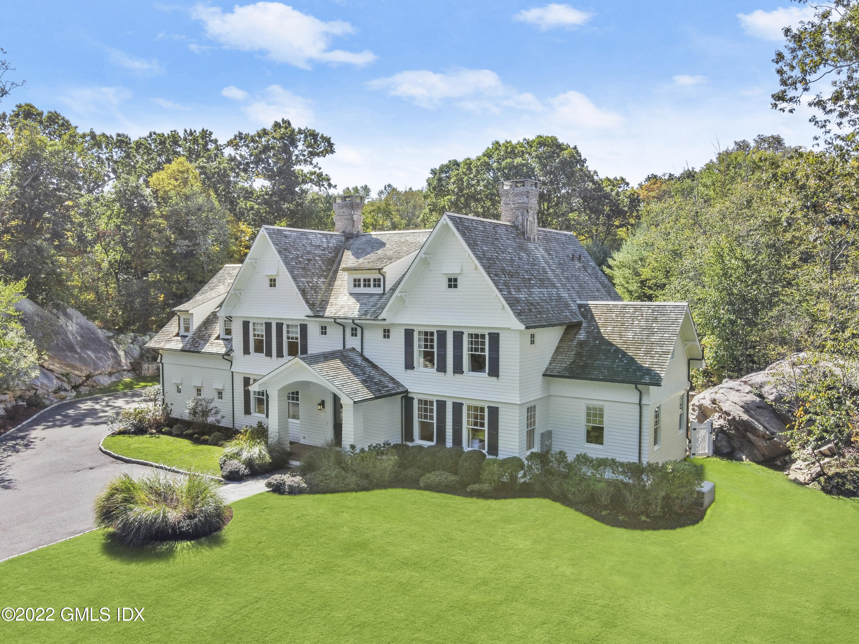 434 Cognewaugh Road Cos Cob, CT 06807 - Photo 1 of 47 a front view of a house with garden