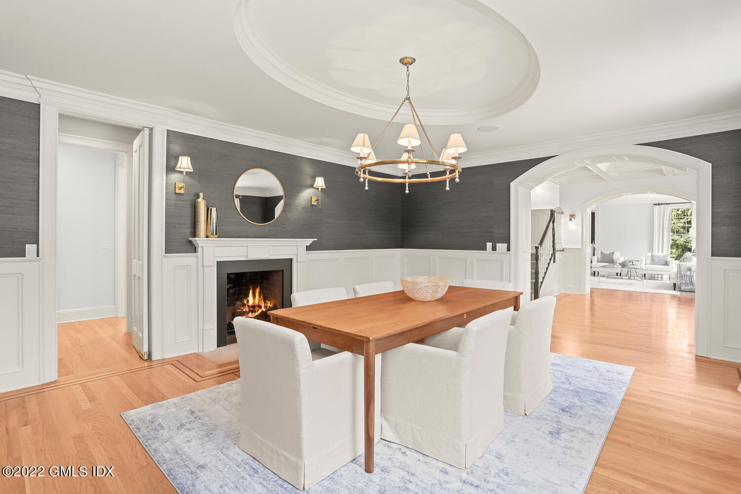 434 Cognewaugh Road Cos Cob, CT 06807 - Photo 15 of 47 a view of a dining room with furniture wooden floor fireplace and chandelier