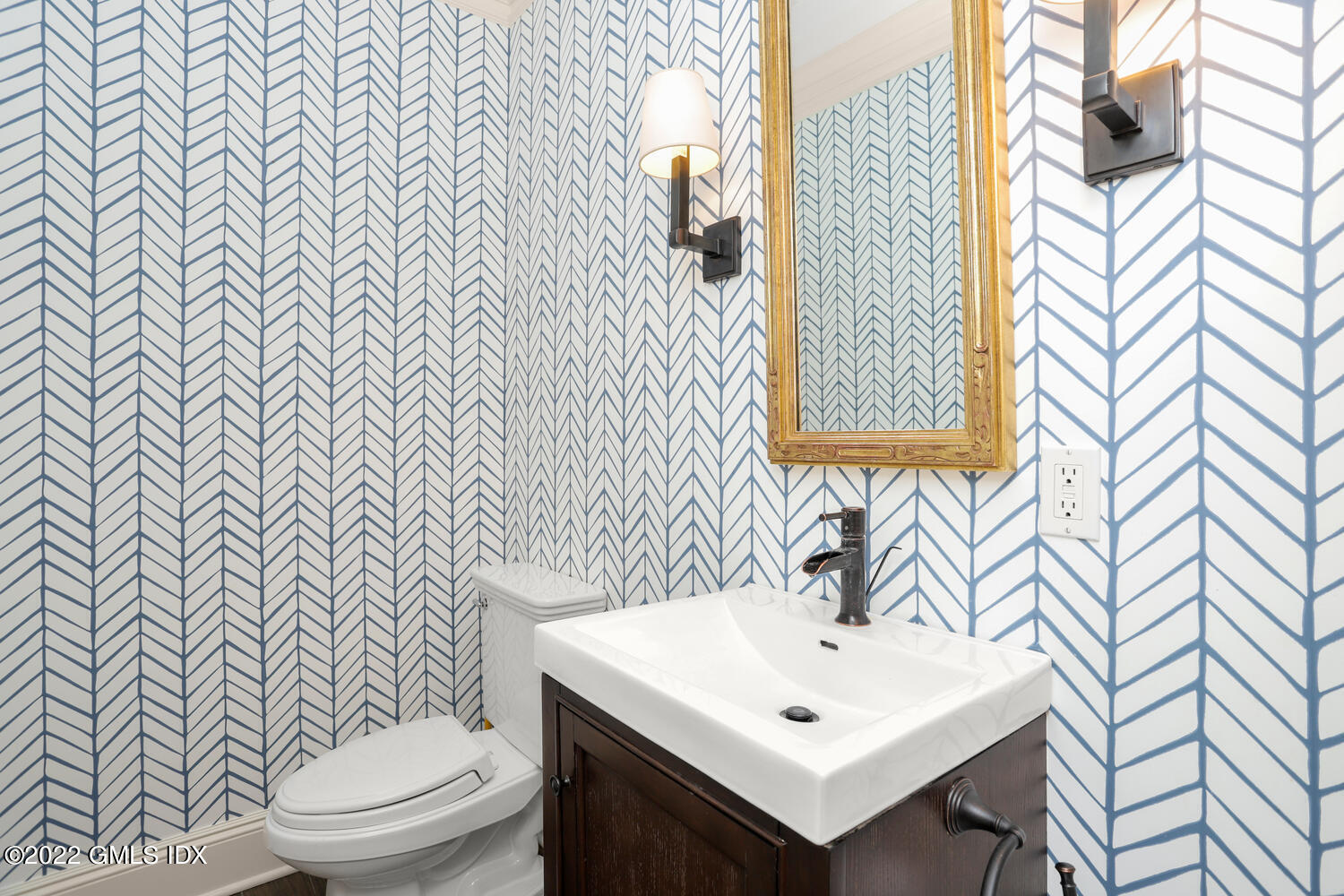 434 Cognewaugh Road Cos Cob, CT 06807 - Photo 17 of 47 a bathroom with a sink a toilet and mirror